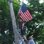 Decorating the Parade Route with American flags